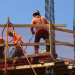 US economy grew at a faster pace in Q2 following Commerce Department revision