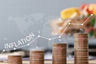 Economic Tension in the UK: Inflation and Job Cuts - An Analysis by FinancialMediaGuide